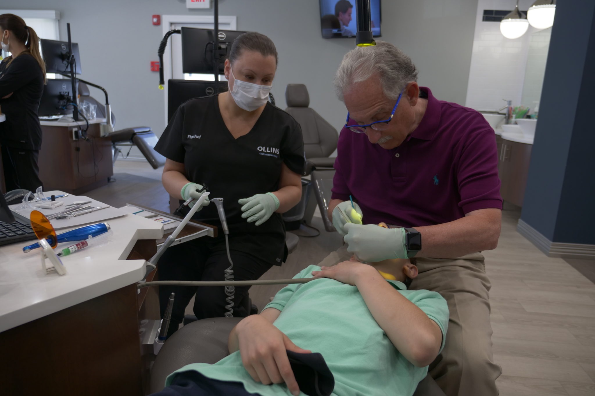 Dr. Ollins with a patient