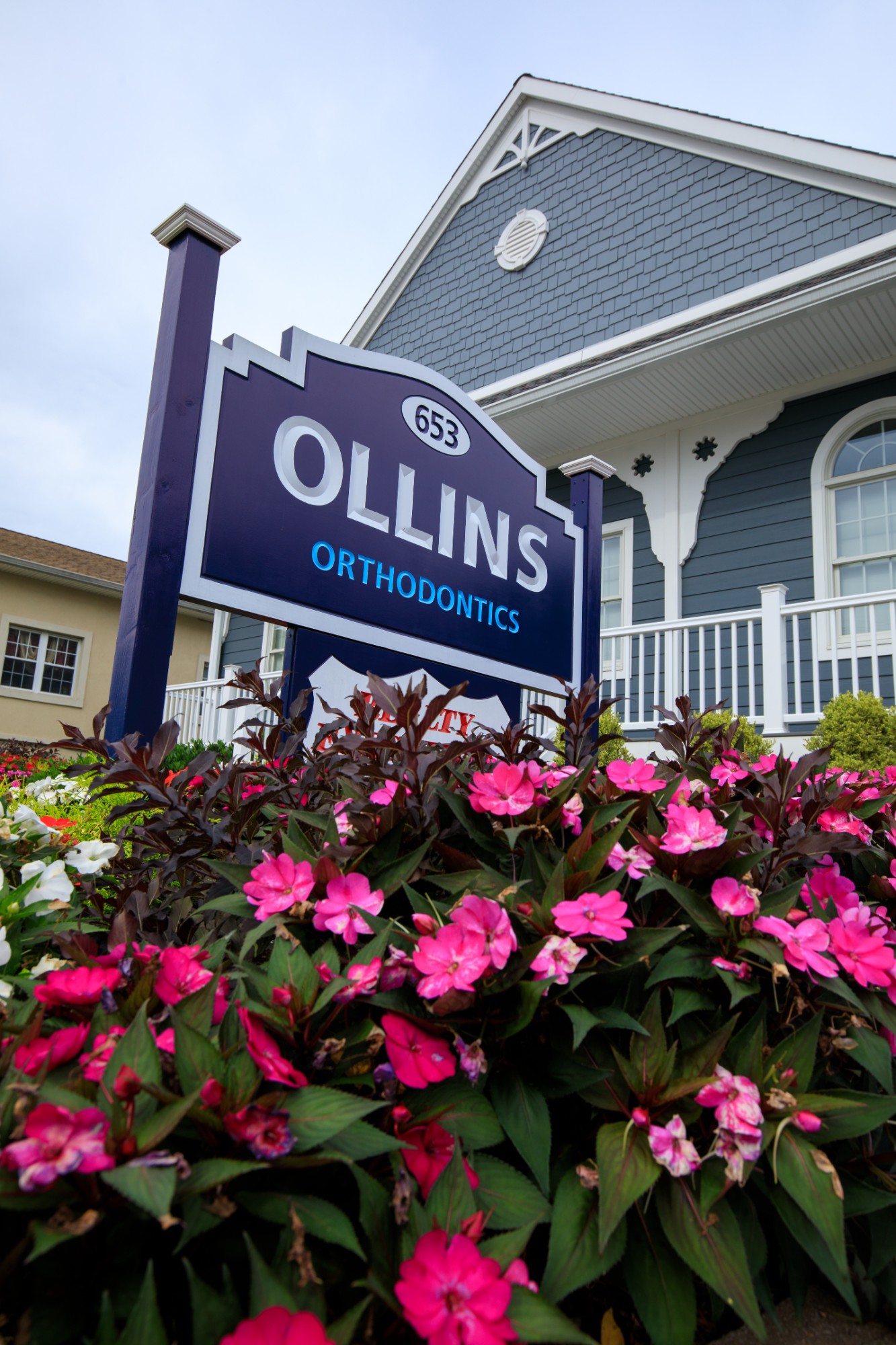 Ollins sign with flowers