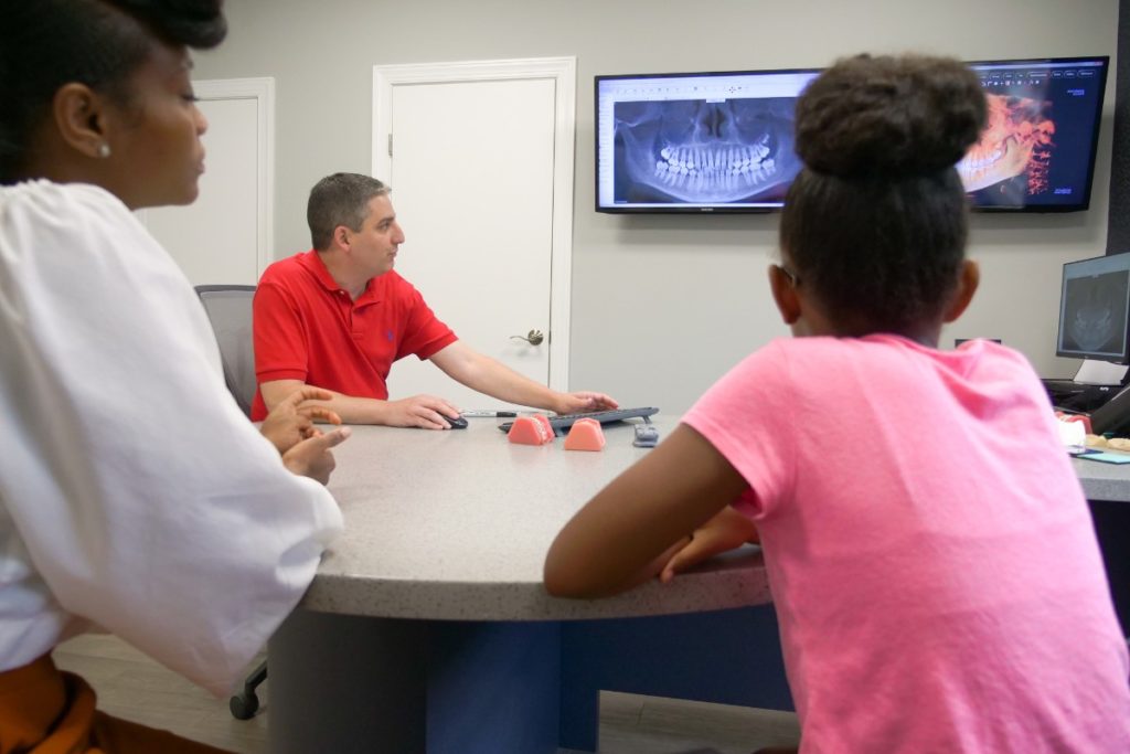 Dr. Ollins talking to patients