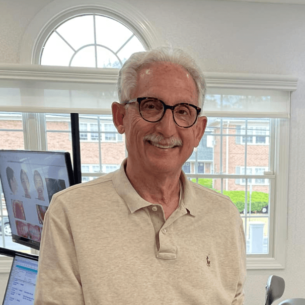 Older man smiling after his work at the top Montclair Orthodontist office
